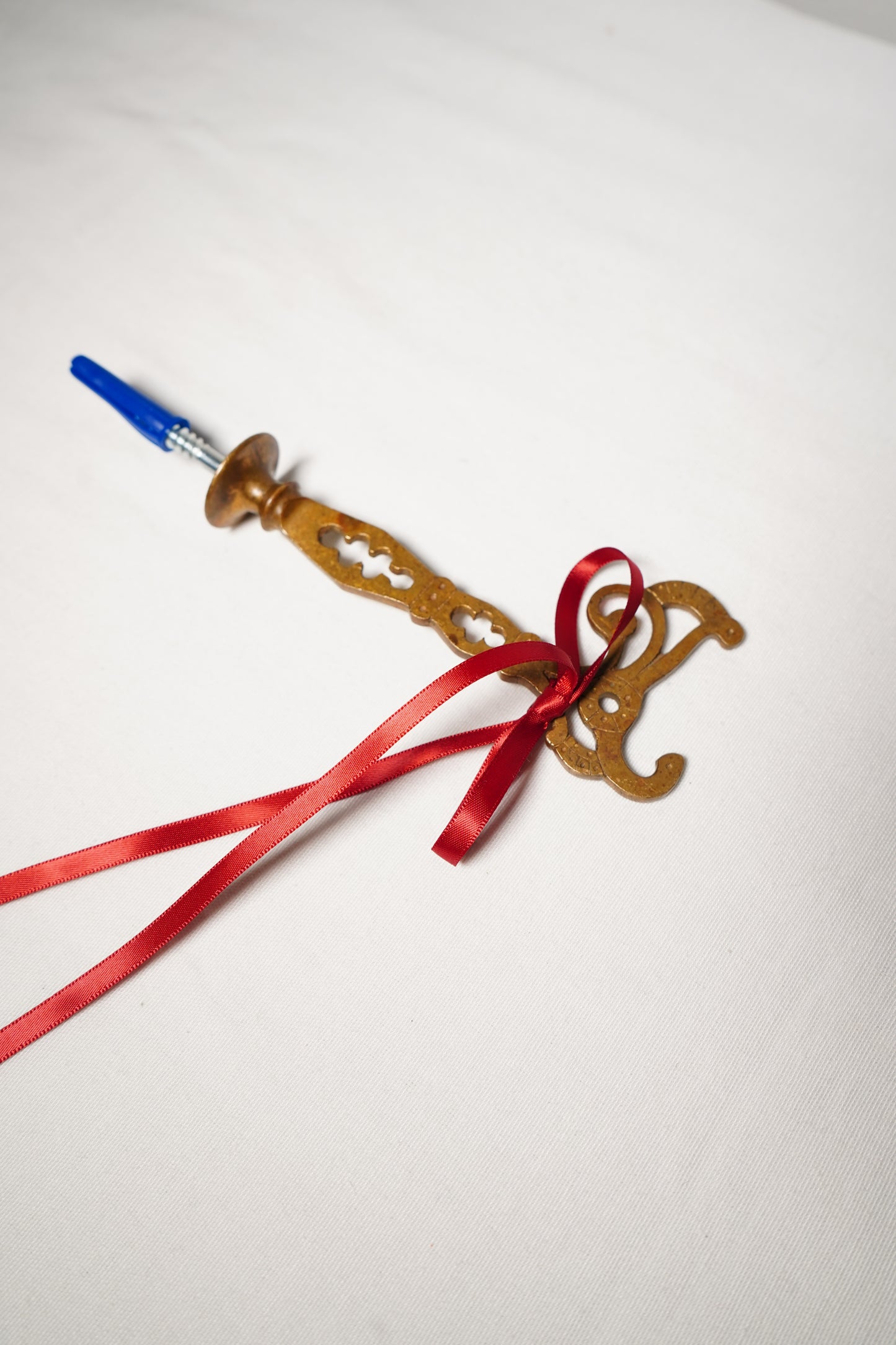 Pair of Ornate Brass French Curtain Rod Brackets with Scrollwork and Quatrefoil Piercing