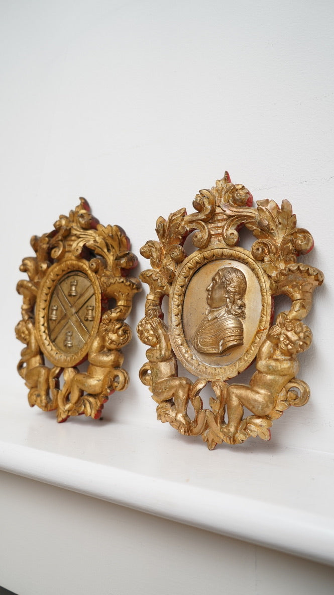 Pair of Giltwood Wall Plaques after William Wetmore Story (c. 1860–80) – Neo-Classical Portrait & Armorial
