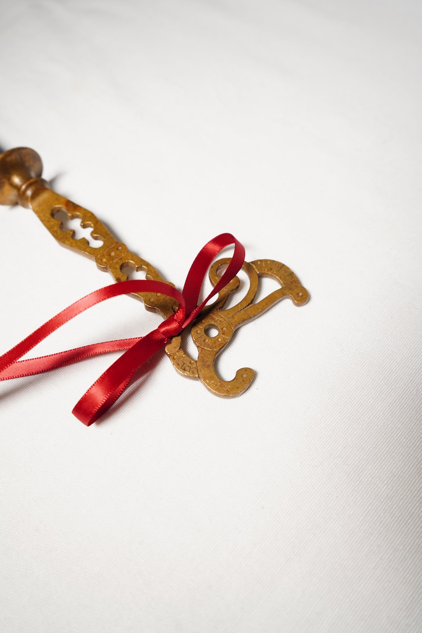 Pair of Ornate Brass French Curtain Rod Brackets with Scrollwork and Quatrefoil Piercing