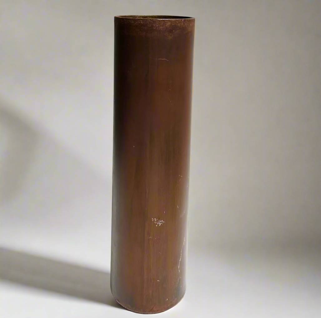 Metal Vase in a cylindrical shape on a white background