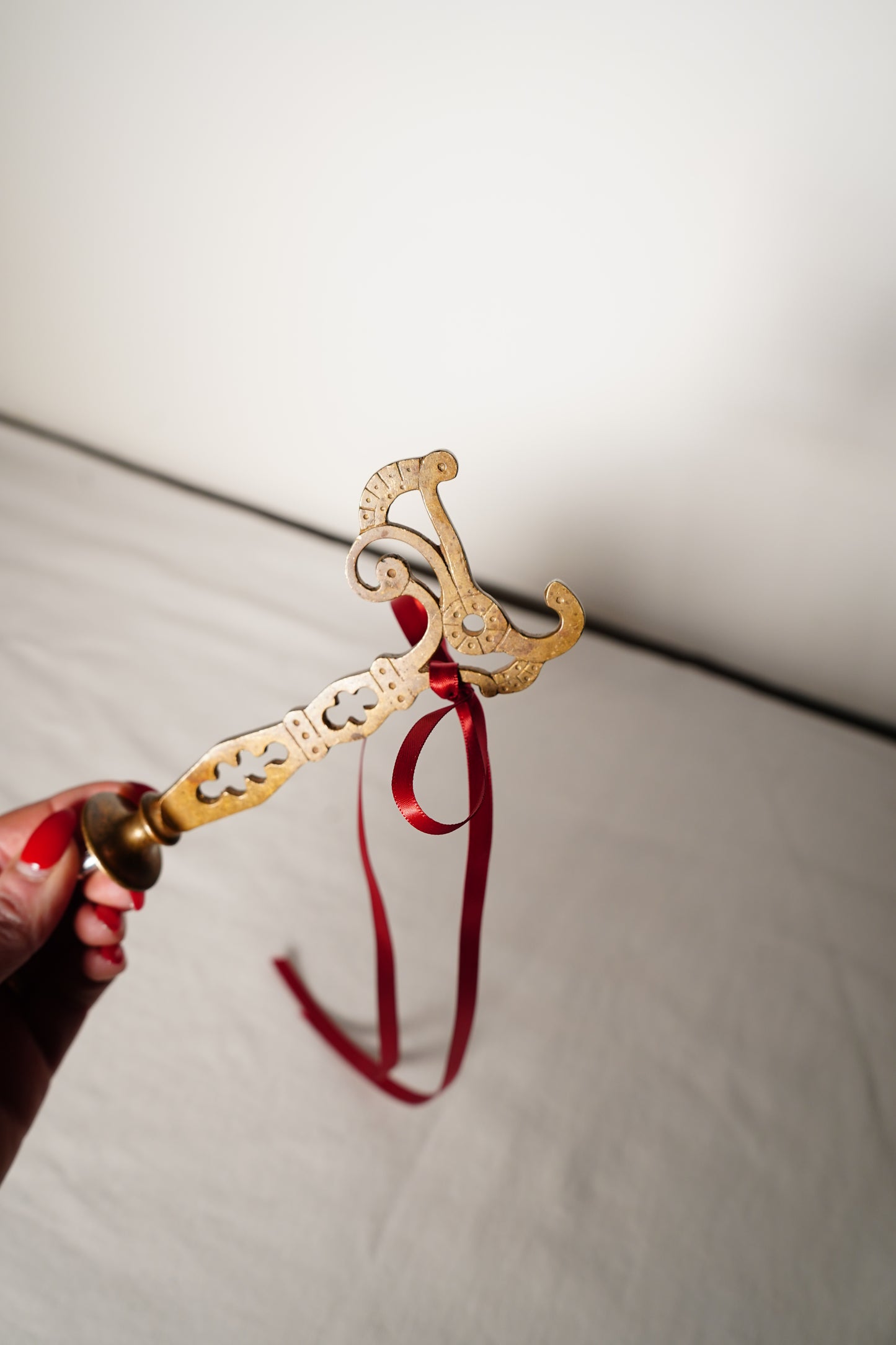 Pair of Ornate Brass French Curtain Rod Brackets with Scrollwork and Quatrefoil Piercing