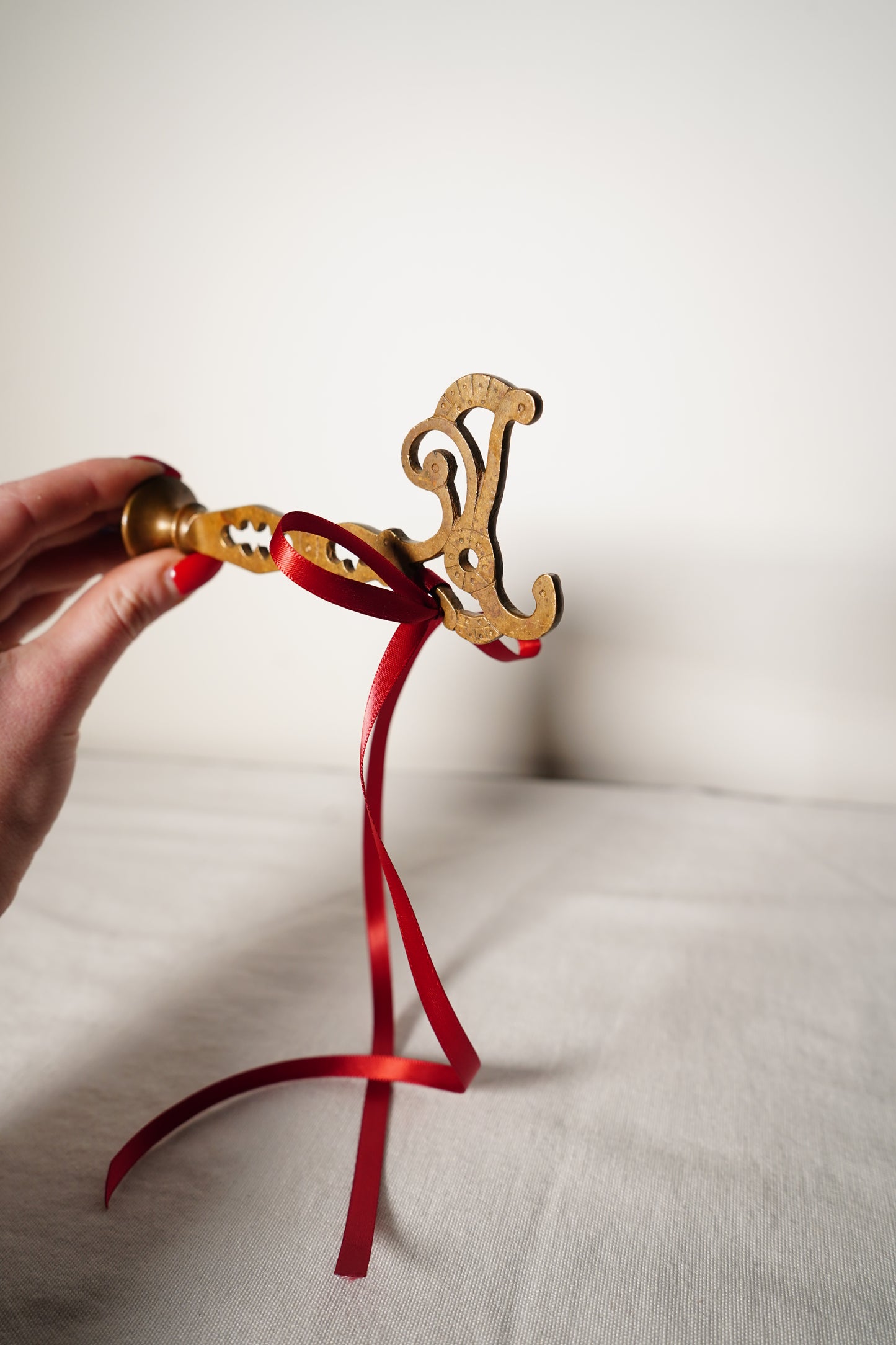 Pair of Ornate Brass French Curtain Rod Brackets with Scrollwork and Quatrefoil Piercing