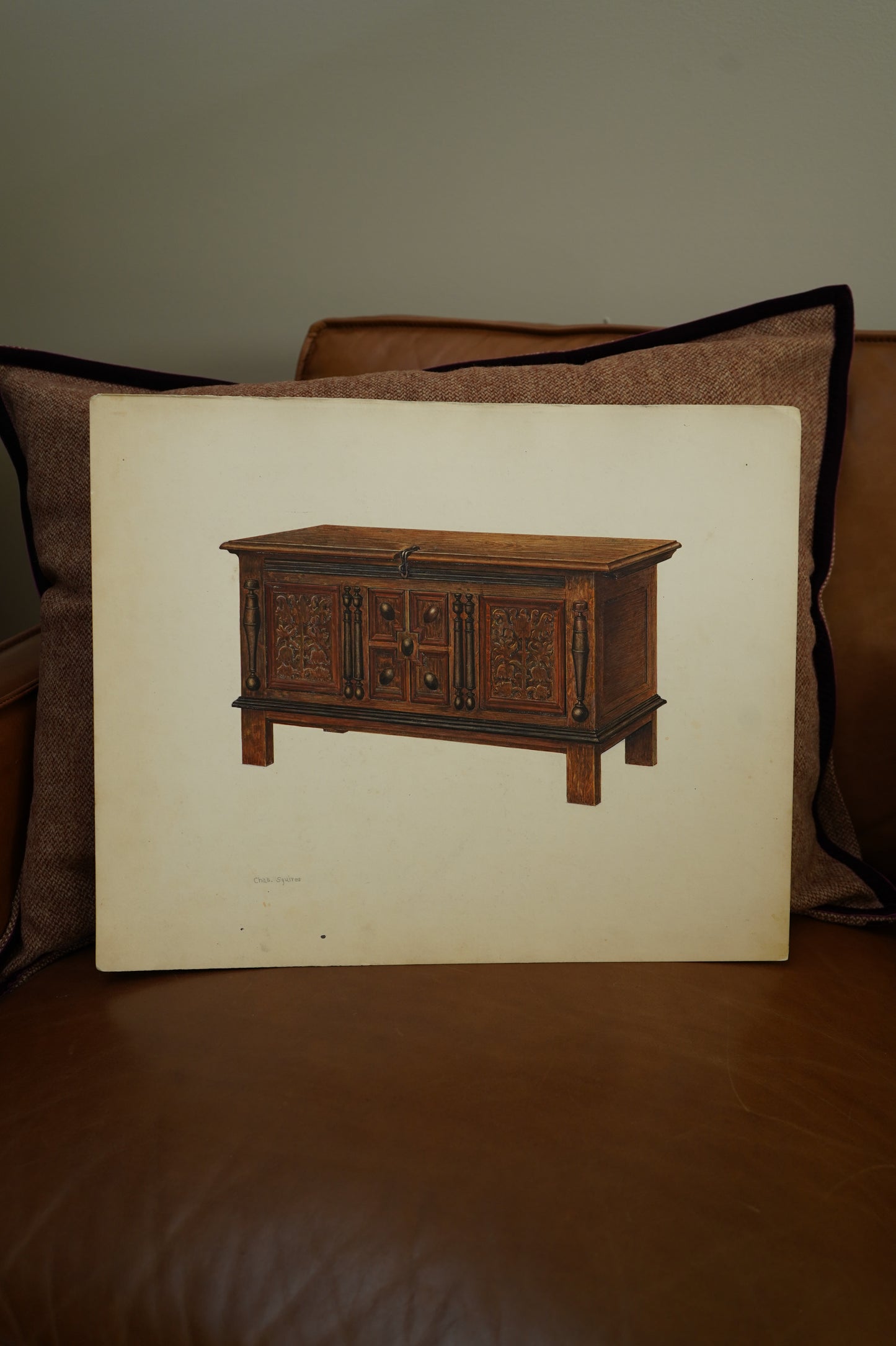 Wooden model of a cart on a white sheet with a brown background
