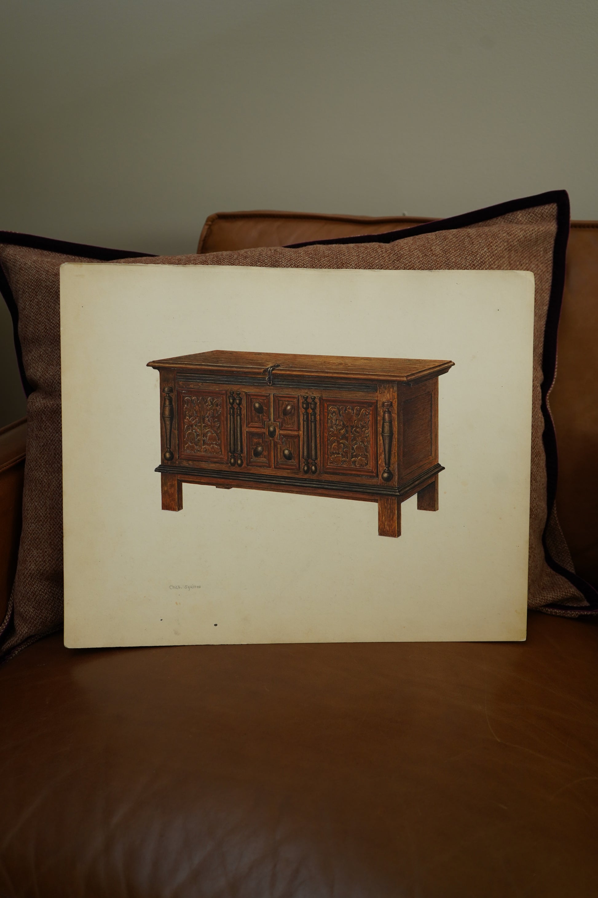 Wooden model of a cart on a white sheet with a brown background