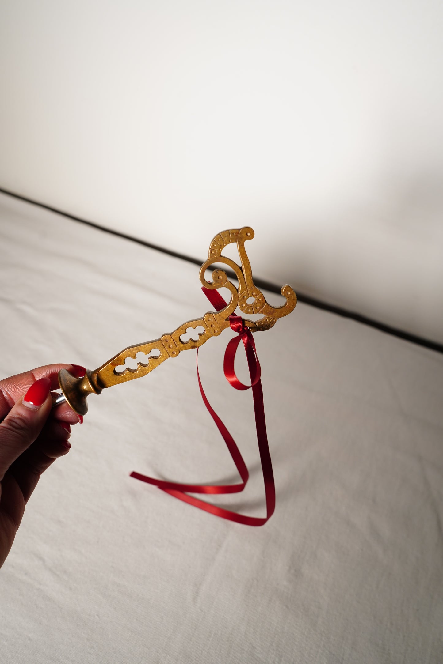 Pair of Ornate Brass French Curtain Rod Brackets with Scrollwork and Quatrefoil Piercing